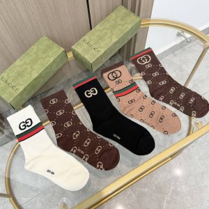 A box of five Gucci socks with packaging. A popular Gucci item, now available! T