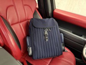 A new high-end Rimowa Never Still backpack. Large, unisex canvas backpack with b