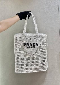 Raffia Tote 1Bg393 This softly deconstructed tote is crafted from raffia, a lig