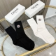 Two pairs of Moncler socks (one box includes packaging). These super popular Mon