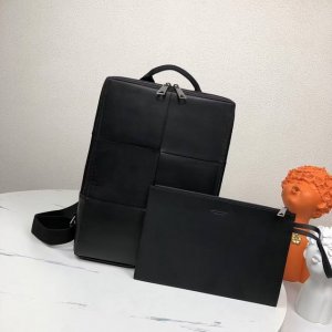 New square woven backpack in black DDD. The classic solid color and vertical we