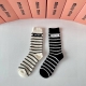 Special packaging for Miu Miu's new striped cashmere slouch socks! Two pairs per