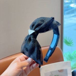 with packagingPrada's new trendy polka dot angled headband. A must-have for a g