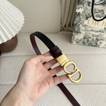 Dior's new belt features a black grained calfskin on one side and a burgundy smo