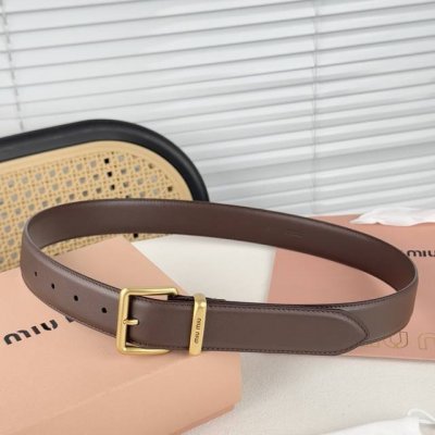 Metal buckle. Belt loops with laser engraved logo. This fine grain leather belt