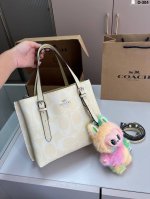 with Labubu pendant Coach tote cream yellow is popular this summer. Coach class