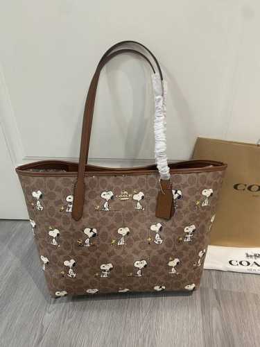 Coach's new May arrival, the new Snoopy City Tote, features the cutest monogram