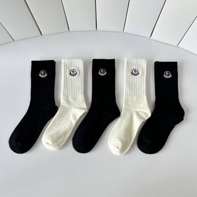 Special packaging for Moncler's latest mid-calf embroidered slouch socks! Five p