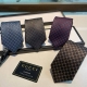 This silk tie features a pattern of geometric rhombuses interwoven with the ini