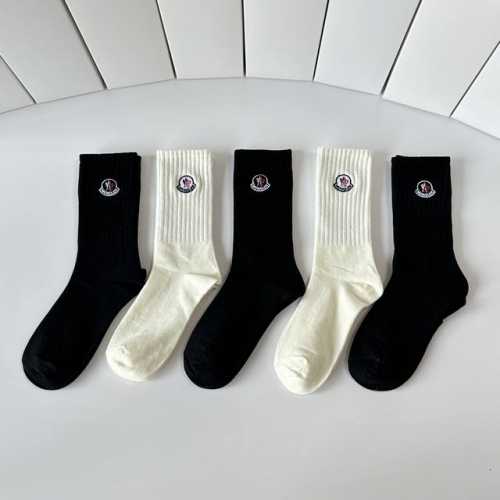 Special packaging for Moncler's latest mid-calf embroidered slouch socks! Five p