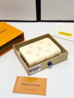 Color: Beige Size: 11x9 Monogram Unplant Leather Update: "Portefeuille Claire."