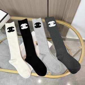 A box of four pairs of Chanel socks with packaging. These super popular Chanel s