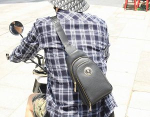 Sold out! This vintage-inspired chest bag from Wang Fanjia is crafted from genui