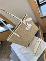 Comes with shoulder pads in a foldable gift box. Coach can hold all the tote ba