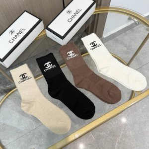 Comes with packaging. A box of four pairs of high-quality Chanel socks