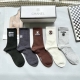 A box of five Chanel high socks, including packaging. High-quality replica of Ch