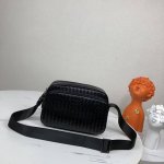 Bv woven messenger bag, a popular item, is made entirely by hand. The soft impor