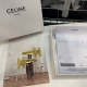 A pair of Celine Arc de Triomphe small side clips/bangs clips with packaging box