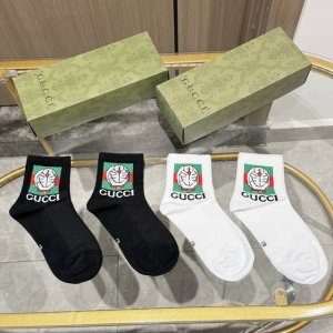 Package includes four pairs of Gucci mid-calf socks, a new style for men and wom