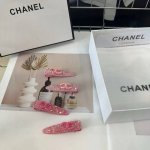 Comes with a box. A pair of Chanel's latest popular small-sized hair clips, hand