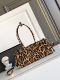 Lussolf Leopard Print This handbag and crossbody bag is made of imported printed