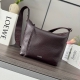 Low new soft grained cowhide crossbody bag. This spacious and soft bag easily ad