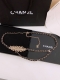 Chanel chain belt in metal, calfskin and rhinestones, gold, black and crystal br